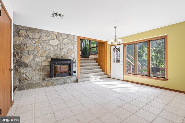 20 Birch Ct, Lancaster, PA 17603 - unfurnished living room with a chandelier, tile patterned floors, a fireplace, and stairs