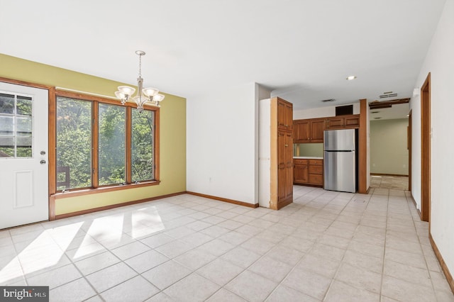 20 Birch Ct, Lancaster, PA 17603 - unfurnished dining area with a chandelier and light tile patterned floors