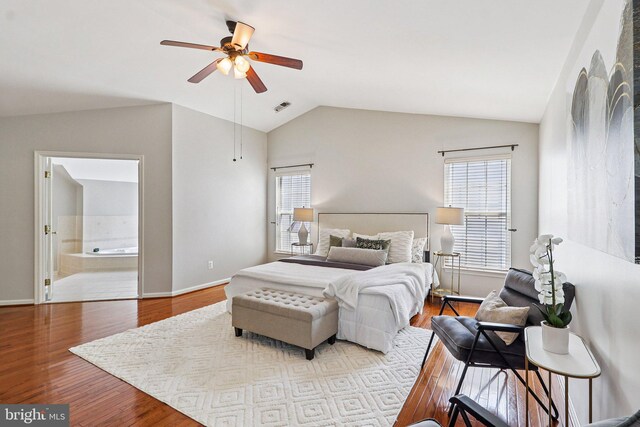 5570 La Vista Dr, Alexandria, VA 22310 - bedroom featuring vaulted ceiling, wood finished floors, connected bathroom, and ceiling fan