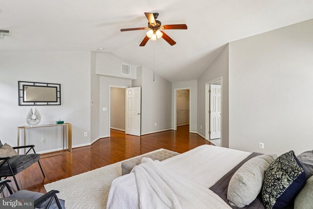 5570 La Vista Dr, Alexandria, VA 22310 - bedroom with wood finished floors, a spacious closet, ceiling fan, and high vaulted ceiling