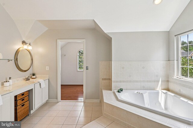 5570 La Vista Dr, Alexandria, VA 22310 - bathroom with vanity, a whirlpool tub, lofted ceiling, and tile patterned floors