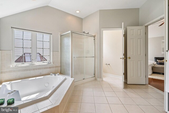 5570 La Vista Dr, Alexandria, VA 22310 - ensuite bathroom with a tub with jets, a shower stall, tile patterned flooring, and lofted ceiling
