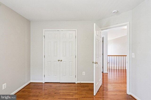 5570 La Vista Dr, Alexandria, VA 22310 - unfurnished bedroom with wood finished floors and a closet