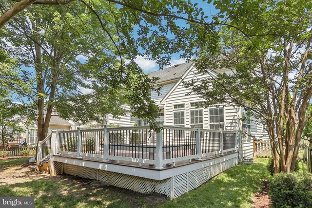 5570 La Vista Dr, Alexandria, VA 22310 - rear view of house with a wooden deck and roof with shingles