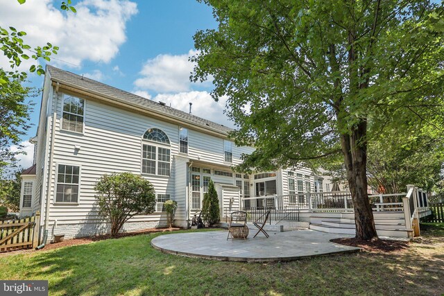 5570 La Vista Dr, Alexandria, VA 22310 - back of property featuring a patio and a wooden deck