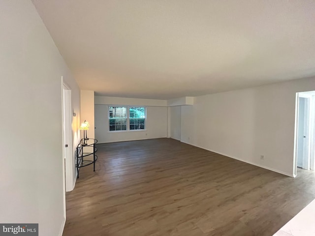 7720 Tremayne Pl Unit 107, Mclean, VA 22102 - unfurnished living room featuring dark wood finished floors