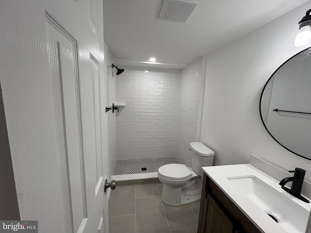 7720 Tremayne Pl Unit 107, Mclean, VA 22102 - bathroom featuring a shower stall, vanity, tile patterned flooring, and recessed lighting