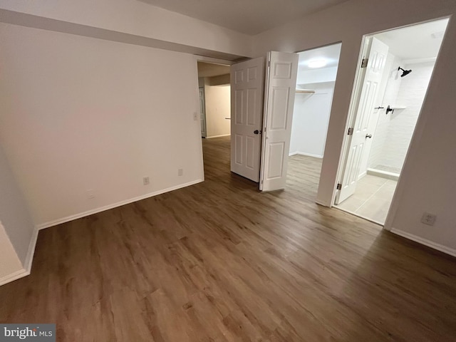 7720 Tremayne Pl Unit 107, Mclean, VA 22102 - unfurnished bedroom with wood finished floors, ensuite bath, and a closet