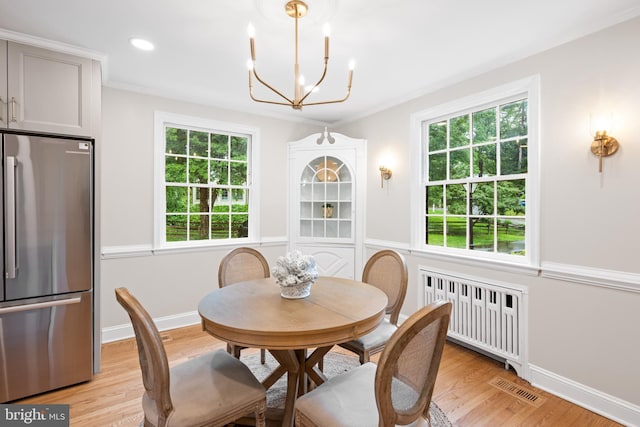 7819 Overbrook, Ruxton, MD 21204 - dining space featuring radiator heating unit, a chandelier, light wood-type flooring, crown molding, and recessed lighting