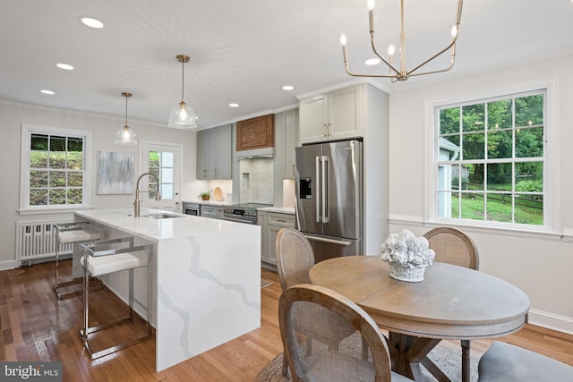 7819 Overbrook, Ruxton, MD 21204 - kitchen featuring high end refrigerator, radiator heating unit, ornamental molding, recessed lighting, and a kitchen island with sink