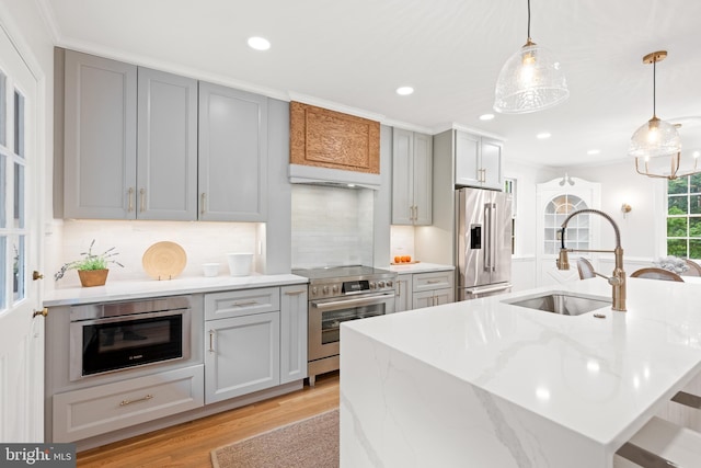 7819 Overbrook, Ruxton, MD 21204 - kitchen featuring appliances with stainless steel finishes, light wood finished floors, gray cabinets, recessed lighting, and backsplash