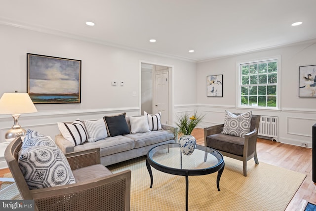 7819 Overbrook, Ruxton, MD 21204 - living room featuring radiator heating unit, wood finished floors, wainscoting, recessed lighting, and ornamental molding