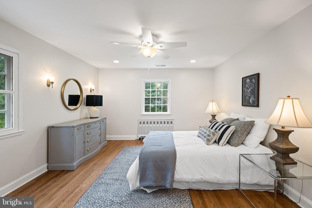 7819 Overbrook, Ruxton, MD 21204 - bedroom featuring radiator heating unit, light wood-type flooring, a ceiling fan, and recessed lighting