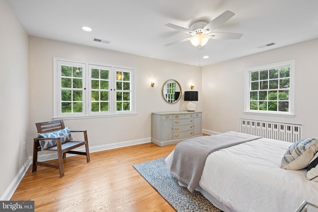 7819 Overbrook, Ruxton, MD 21204 - bedroom with radiator, multiple windows, light wood finished floors, and recessed lighting