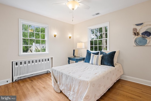 7819 Overbrook, Ruxton, MD 21204 - bedroom with radiator, wood finished floors, and a ceiling fan