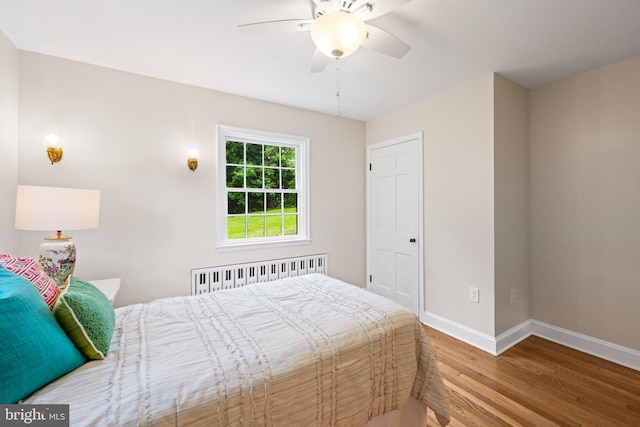 7819 Overbrook, Ruxton, MD 21204 - bedroom with radiator, wood finished floors, and ceiling fan