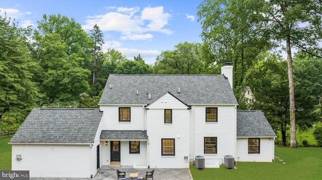 7819 Overbrook, Ruxton, MD 21204 - view of front of property featuring a high end roof, a chimney, a front lawn, and brick siding