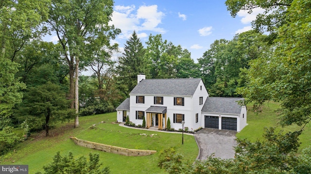 7819 Overbrook, Ruxton, MD 21204 - view of front of home featuring a garage, a chimney, gravel driveway, a front yard, and roof with shingles