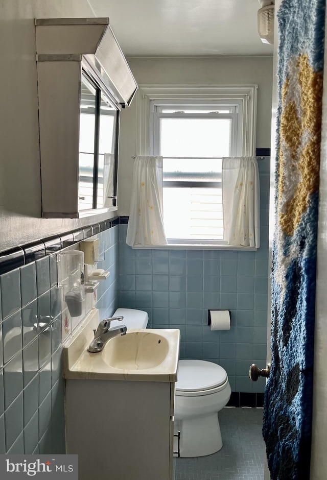 2100 Lincoln Ave, Wilmington, DE 19809 - bathroom with tile walls, tile patterned flooring, and vanity