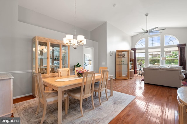 3709 Apple Cider Ct, Dumfries, VA 22025 - dining space with a chandelier, light wood-style flooring, high vaulted ceiling, and a ceiling fan