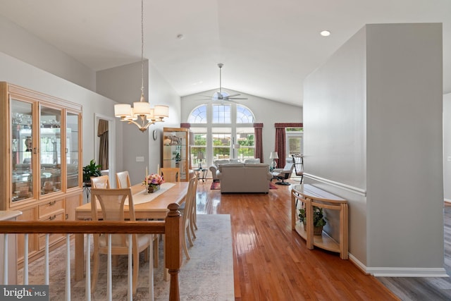 3709 Apple Cider Ct, Dumfries, VA 22025 - dining space with vaulted ceiling, light wood-type flooring, a ceiling fan, and a chandelier