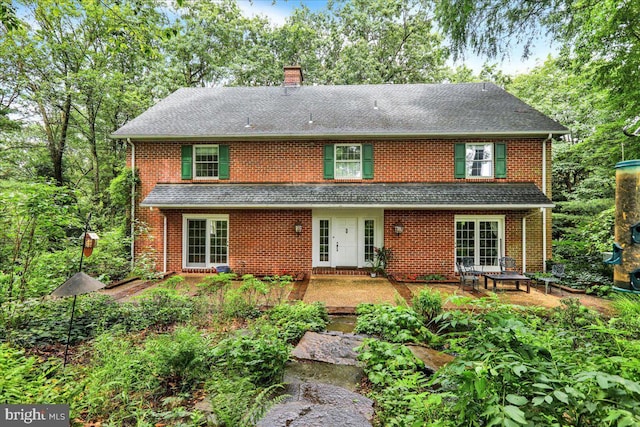 154 Deer Hill Rd, Reading, PA 19607 - back of house with a chimney, a shingled roof, and brick siding