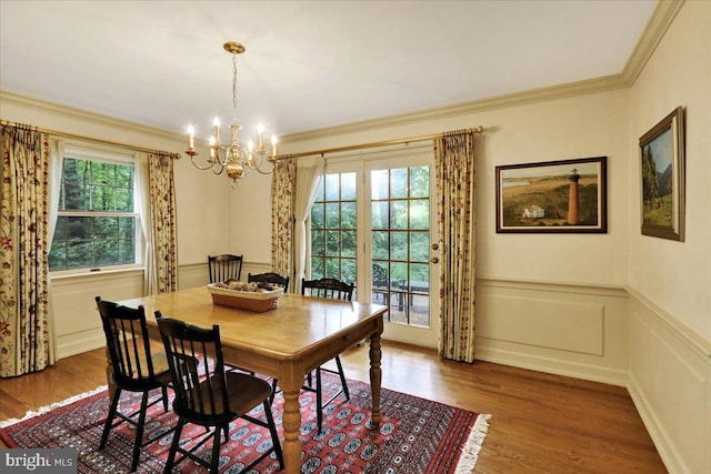 154 Deer Hill Rd, Reading, PA 19607 - dining area with a chandelier, wood finished floors, plenty of natural light, crown molding, and wainscoting