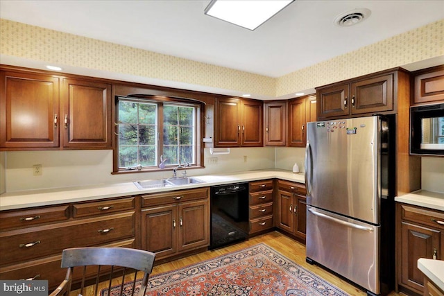 154 Deer Hill Rd, Reading, PA 19607 - kitchen featuring black appliances, light wood-type flooring, and light countertops