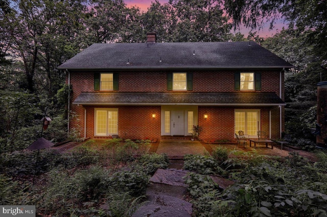 154 Deer Hill Rd, Reading, PA 19607 - view of front of home with a chimney, brick siding, and roof with shingles