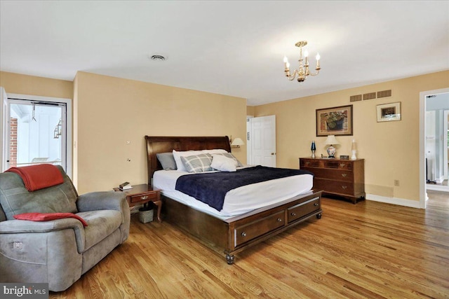 154 Deer Hill Rd, Reading, PA 19607 - bedroom with light wood finished floors and a chandelier
