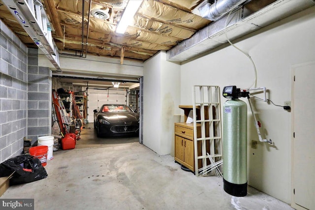 154 Deer Hill Rd, Reading, PA 19607 - basement with a water softener system, concrete block wall, and a garage