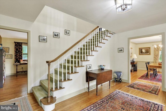 154 Deer Hill Rd, Reading, PA 19607 - stairway with wood finished floors and a chandelier