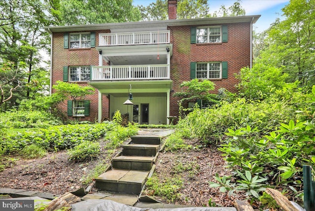 154 Deer Hill Rd, Reading, PA 19607 - view of front of property featuring a balcony, brick siding, and a chimney