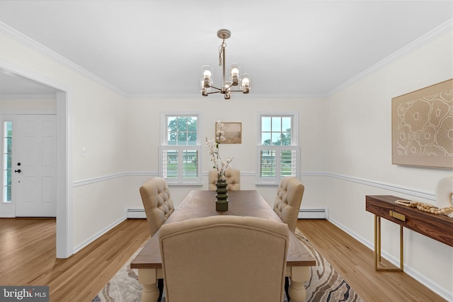 69 Hickory Ln, Chalfont, PA 18914 - dining space with baseboard heating, a chandelier, light wood-type flooring, plenty of natural light, and ornamental molding