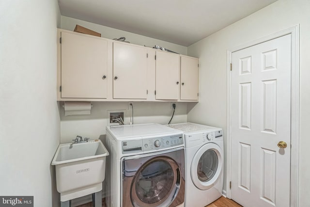 69 Hickory Ln, Chalfont, PA 18914 - laundry room featuring cabinet space, washing machine and dryer, and light wood finished floors