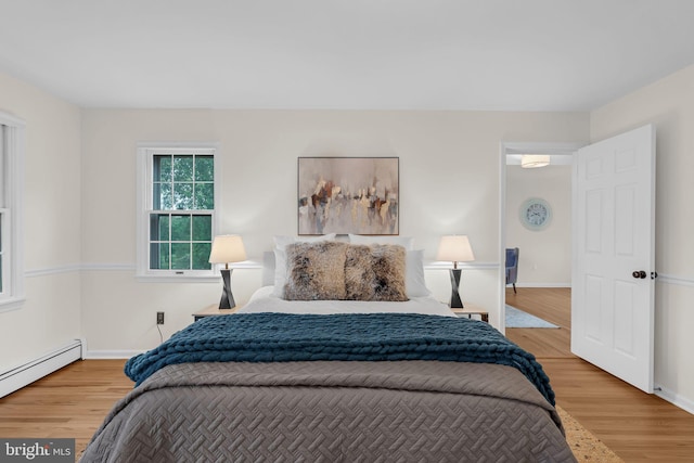 69 Hickory Ln, Chalfont, PA 18914 - bedroom featuring baseboard heating and wood finished floors