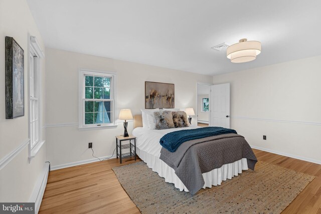 69 Hickory Ln, Chalfont, PA 18914 - bedroom featuring wood finished floors and a baseboard heating unit