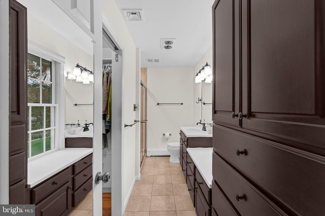 69 Hickory Ln, Chalfont, PA 18914 - full bathroom with a shower with door, a baseboard radiator, vanity, and healthy amount of natural light