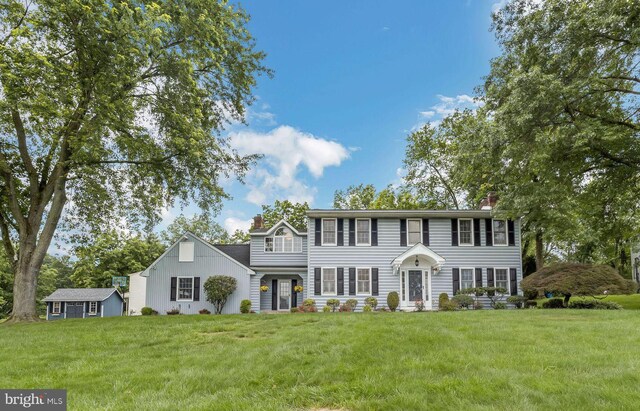 69 Hickory Ln, Chalfont, PA 18914 - colonial home featuring a chimney and a front lawn