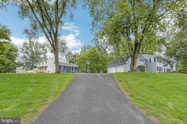 69 Hickory Ln, Chalfont, PA 18914 - view of front facade with an outbuilding, a front lawn, and a detached garage