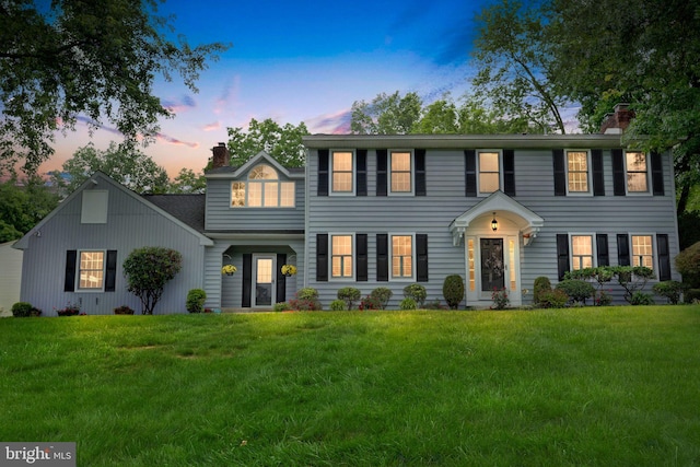 69 Hickory Ln, Chalfont, PA 18914 - colonial house featuring a chimney and a lawn