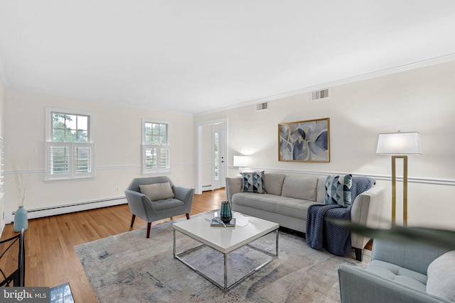 69 Hickory Ln, Chalfont, PA 18914 - living area featuring ornamental molding, wood finished floors, a baseboard heating unit, and a baseboard radiator