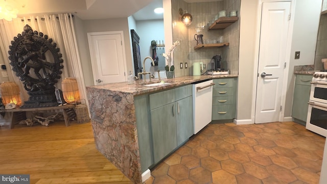 715 6th St NW Unit 1002, Washington, DC 20001 - kitchen featuring green cabinets, white dishwasher, decorative backsplash, range, and stone countertops