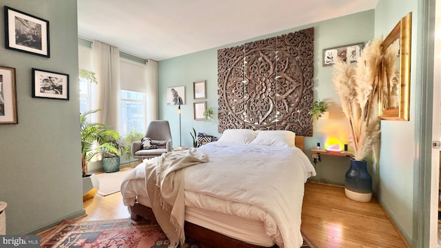 715 6th St NW Unit 1002, Washington, DC 20001 - bedroom with wood finished floors and baseboards