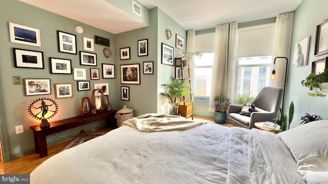 715 6th St NW Unit 1002, Washington, DC 20001 - bedroom featuring wood finished floors and baseboards