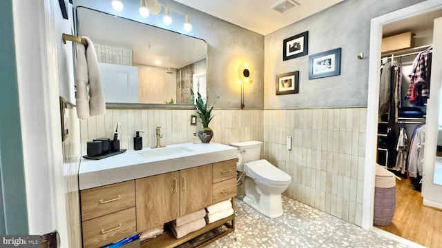 715 6th St NW Unit 1002, Washington, DC 20001 - bathroom featuring vanity and tile walls