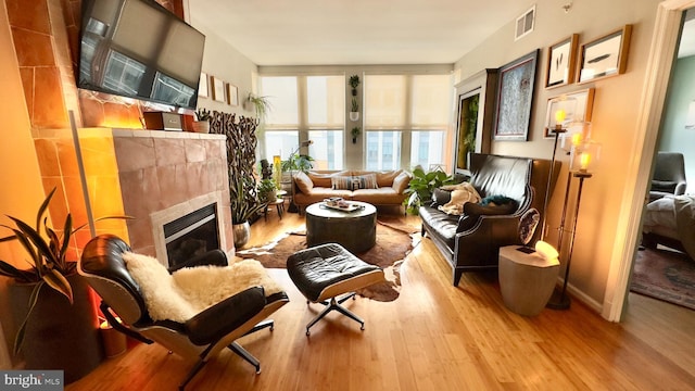 715 6th St NW Unit 1002, Washington, DC 20001 - living area featuring wood finished floors and a tile fireplace