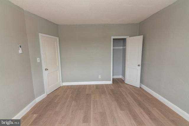 1304 N Linwood Ave, Baltimore, MD 21213 - unfurnished bedroom with light wood-style flooring and a closet