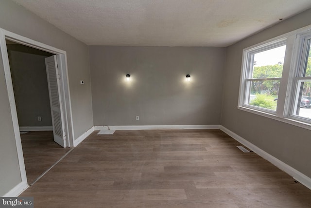 1304 N Linwood Ave, Baltimore, MD 21213 - unfurnished room with wood finished floors and baseboards