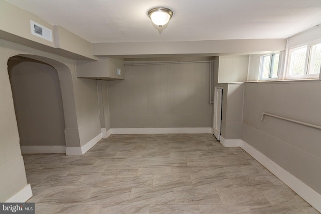 1304 N Linwood Ave, Baltimore, MD 21213 - basement with arched walkways and light marble finish flooring
